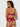 Woman wearing a red lace lingerie set on a white background