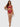Woman wearing a red lingerie set with sheer stockings on a white background