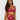 Woman wearing a red lace lingerie set on a white background