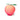 Peach suction vibrator with a green leaf on a white background