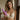 Woman holding a purple Shegasm Thrusting Suction Rabbit