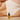 Slow Sex anal soothing oil bottle in front of a woman wearing nude underwear