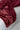 Red blanket draped over a light gray surface