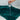 Person pouring water from a glass onto a green towel on a white surface