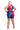 A woman modeling a glossy, short, two-tone harlequin costume from the back, featuring red, blue, and black panels, a silver rhinestone-embellished waistband, fishnet stockings, and red high heels against a white background.