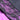 Close-up of black lace trim on a purple harness background