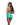 Woman wearing a green and blue tropical print romper on a white background