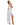 Woman wearing a white and gold Greek goddess costume on a white background