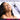 Woman using a white handheld massager with text 'Enhance Your Wand Experience' on a white background.