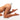 Naked legs with a white Fluffy Bunny Tail Anal Plug on a white background