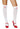 A pair of white nurse stockings with red crosses, designed to be worn with high heels.