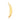 Gold banana-shaped dildo on a white background